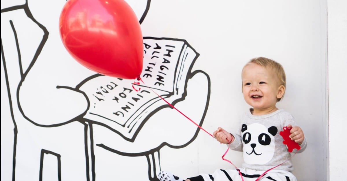 Image of kid with a balloon