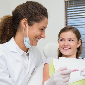 Image of a dentist working with a kid