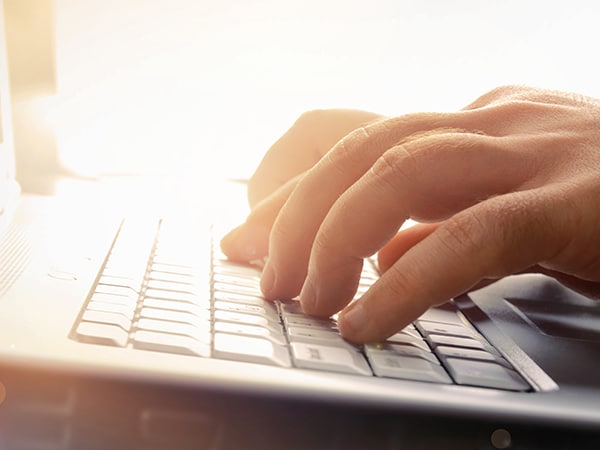image of typing on a keyboard