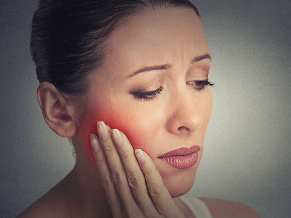 image of a woman with a toothache