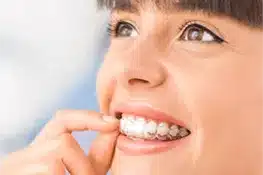 Woman flossing teeth with white smile, demonstrating dental hygiene care