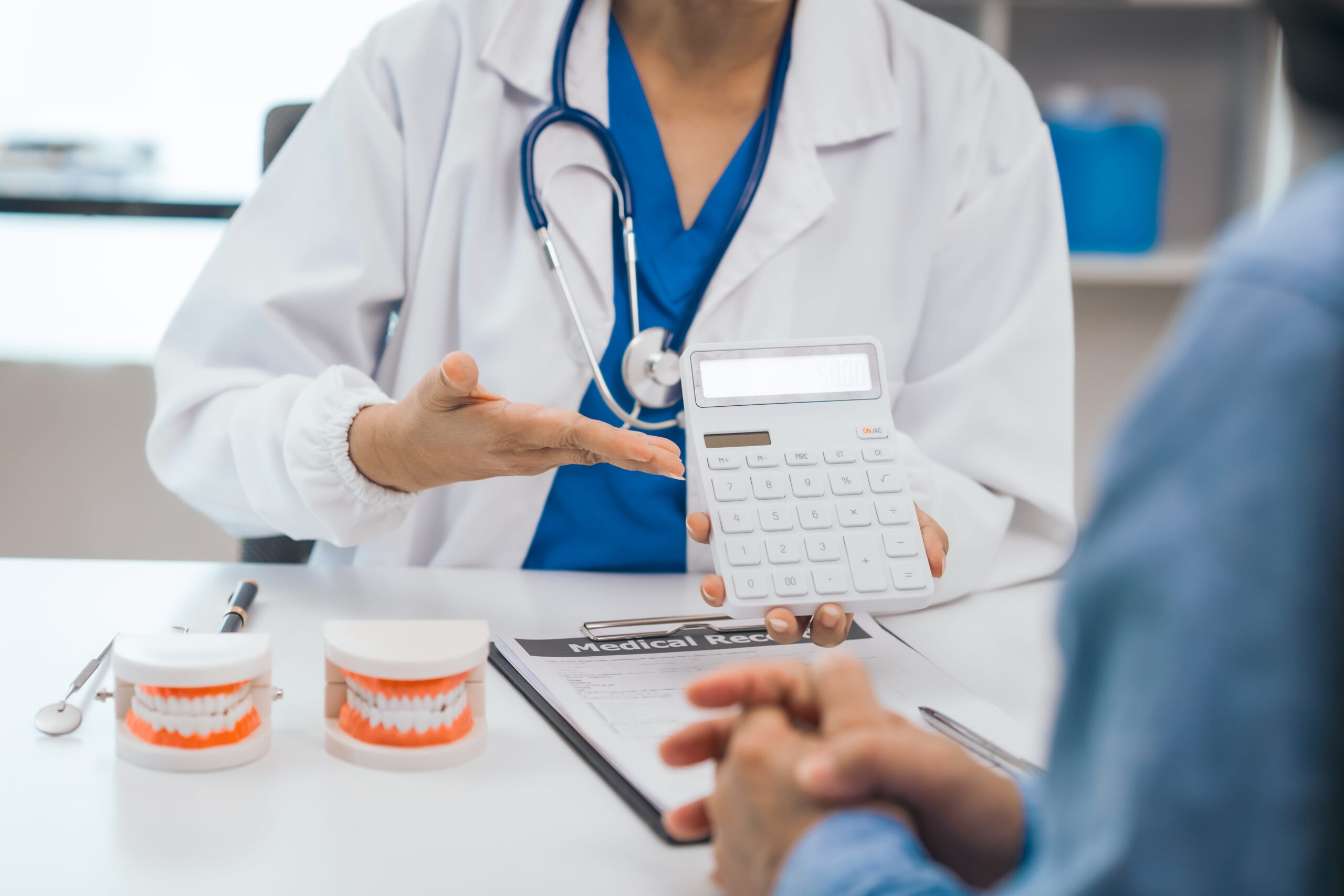 Patient consulting with a dentist in Seattle about the cost of a dental visit without insurance