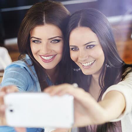 image of two women taking a selfie